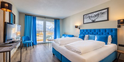 Golfurlaub - Umgebungsschwerpunkt: Berg - Tirol - Deluxe Doppelzimmer in blau - Vitalhotel Kaiserhof