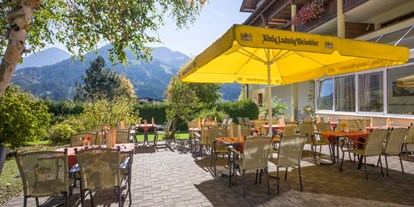 Golfurlaub - Sonnenterrasse - Tiroler Unterland - Geniessen Sie die wunderbare Aussicht oder Ihre Mahlzeiten auf unserer Sonnenterrasse. - Hotel Alpenhof Brixen