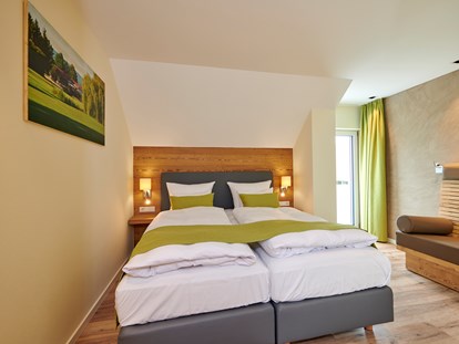 Golfurlaub - Garten - Bachhof Ferienhaus Schlafzimmer - Bachhof Resort Straubing - Hotel und Apartments