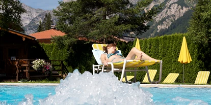 Golfurlaub - Wäscheservice - Berwang - Outdoorpool 29°C - Hotel Karlwirt - Alpine Wellness am Achensee