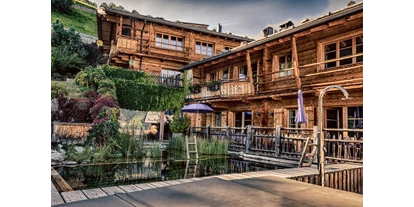 Golfurlaub - Abendmenü: 3 bis 5 Gänge - Kirchberg in Tirol - HochLeger Chalets Aussenansicht - HochLeger Luxury Chalet Resort