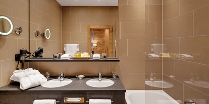 Golfurlaub - Restaurant - Beispiel Badezimmer - Hotel Morosani Schweizerhof