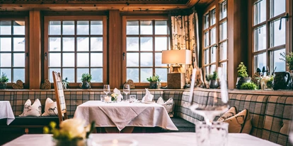 Golfurlaub - Sauna - Gedeckter Tisch im Restaurant - Hotel Post Lermoos