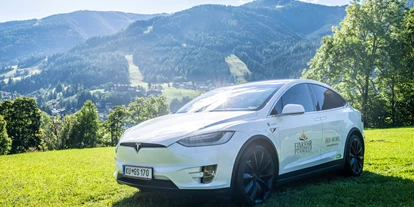 Golfurlaub - Sauna - Hauseigener Tesla Verleih - Trattlers Hof-Chalets