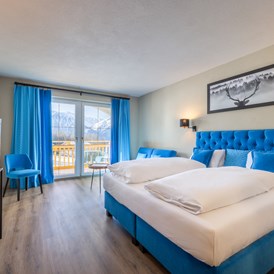 Golfhotel: Deluxe Doppelzimmer in blau - Vitalhotel Kaiserhof