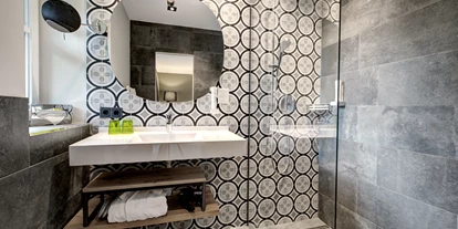 Golfurlaub - Restaurant - Badezimmer - Hotel Gut Brandlhof