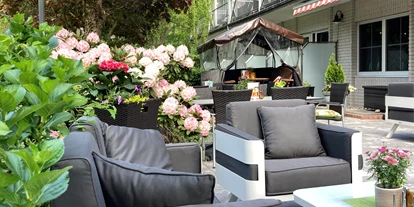 Golfurlaub - Deutschland - Gartenterrasse zum Erholen und Verweilen - NordWest-Hotel "Bad Zwischenahn"